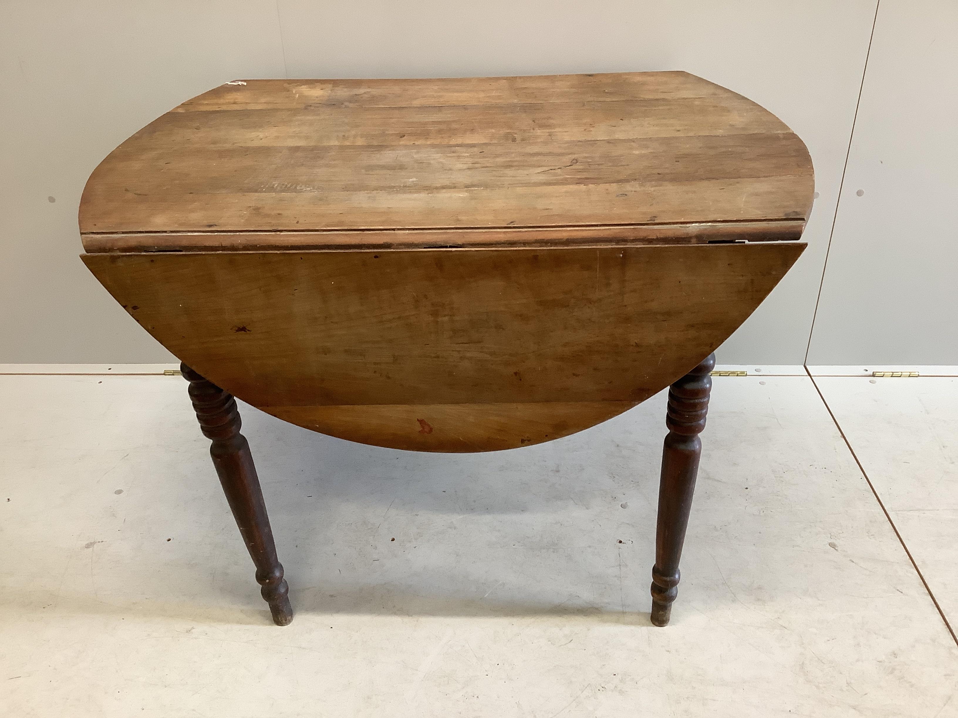 A 19th century French cherry drop flap dining table, 148cm extended, depth 111cm, height 74cm